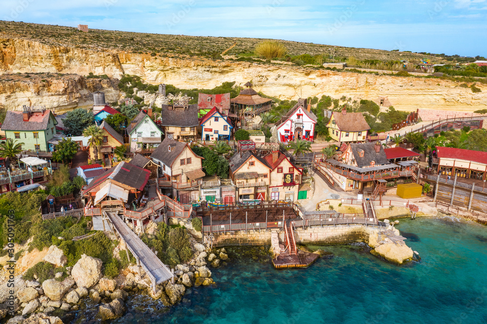 Popeye Village, also known as Sweethaven Village. Sunny day, blue sea, blue sky. Close up view. Mellieha city. Malta 