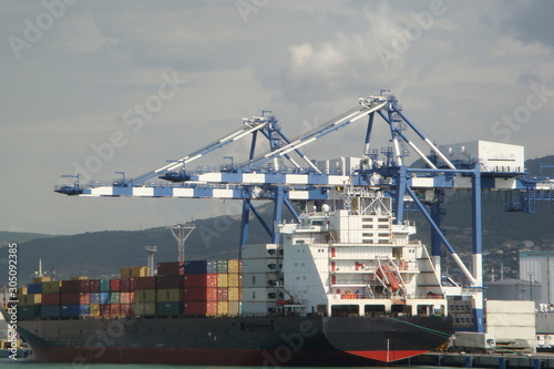 the ship standing in the port with a cargo