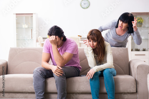 Fotografía Young family and mother-in-law in family issues concept