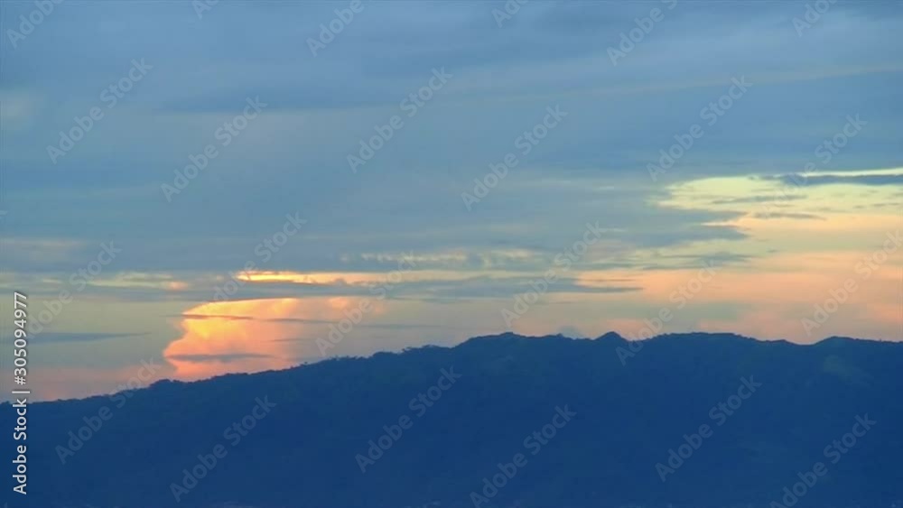 Time Lapse, thunder clouds forming over mountain range Time Lapse, thunder clouds forming over mountain range