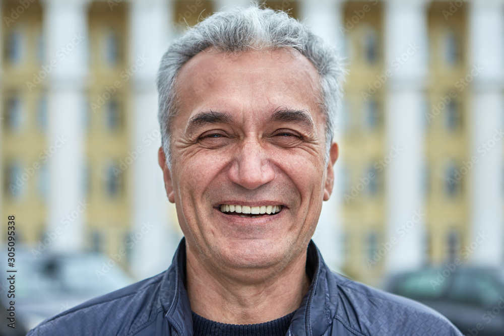 The joyful face of a middle-aged man over 50 years The joyful face of a middle-aged man over 50 years