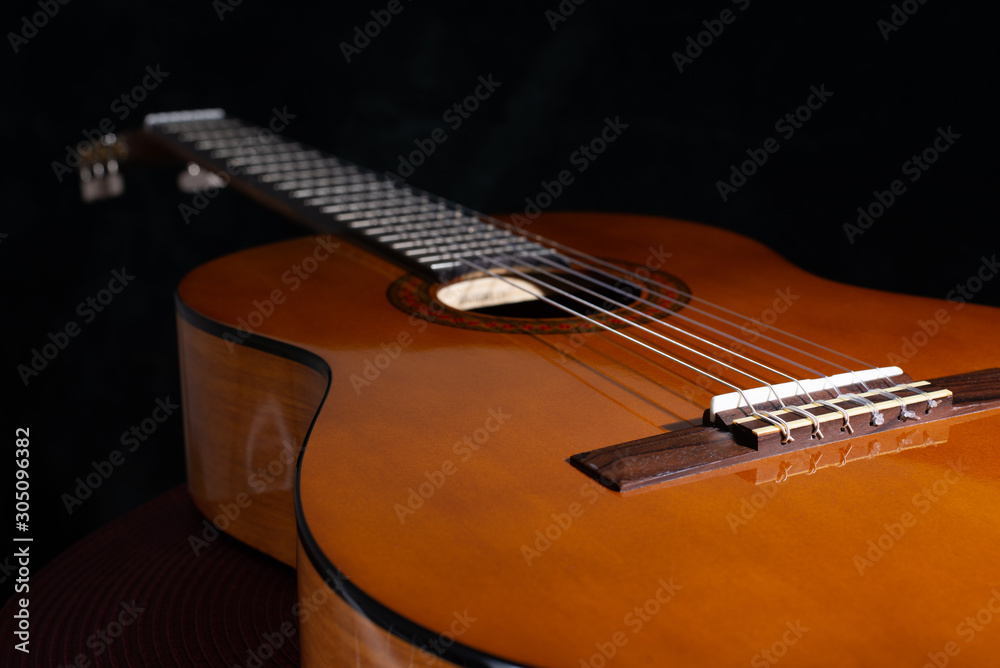 Fototapeta premium acoustic guitar on black background