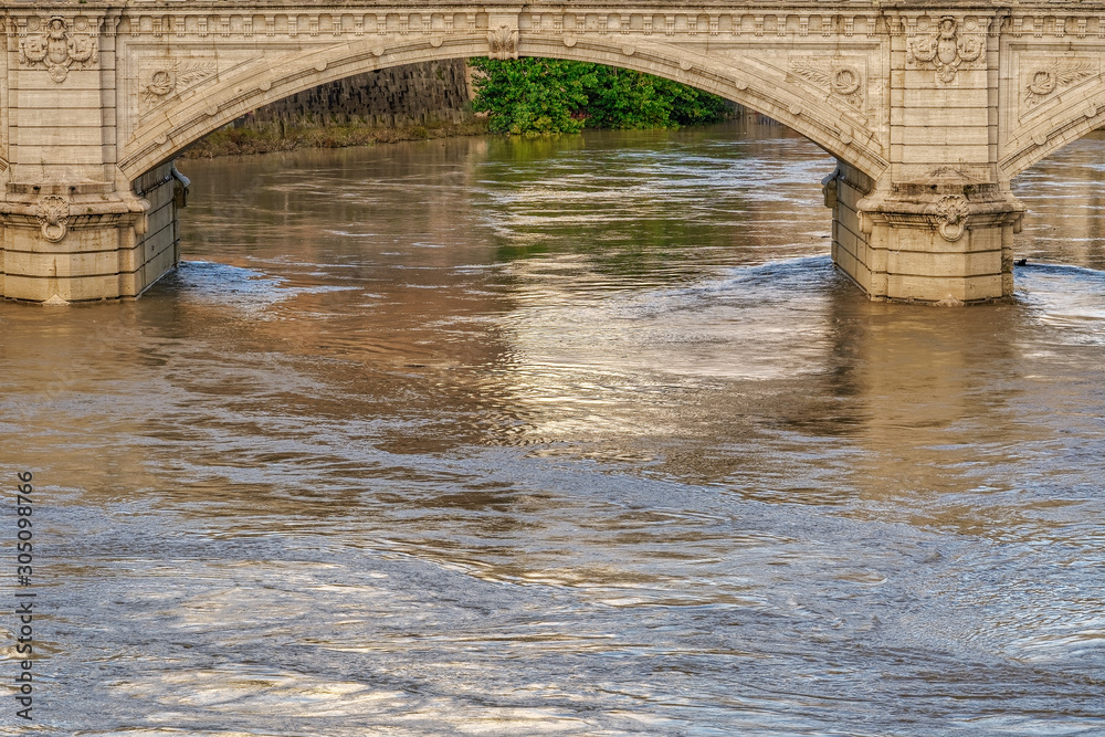 Rome, Italy Tiber river high tide water rise. Day view of high water level flooding the banks of the river crossing the Italian capital, after heavy rain.