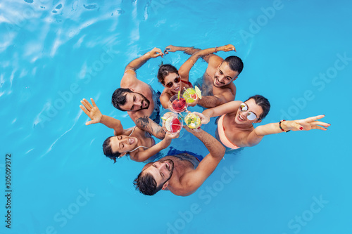 Group of friends have pool party photo