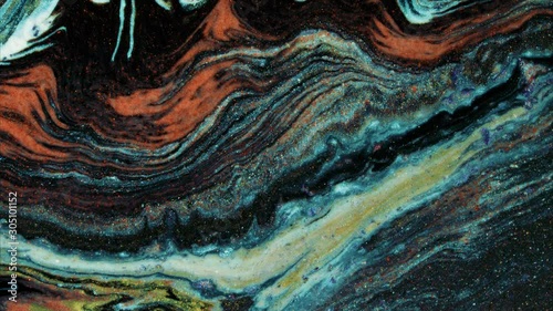 Multicolored acrylic paint. Slow motion. Fantastic surface. Abstract colorful paint. Top view.