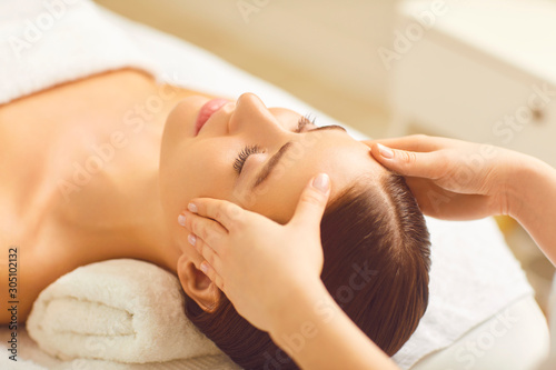 Beautiful woman has a facial massage in a beauty clinic.