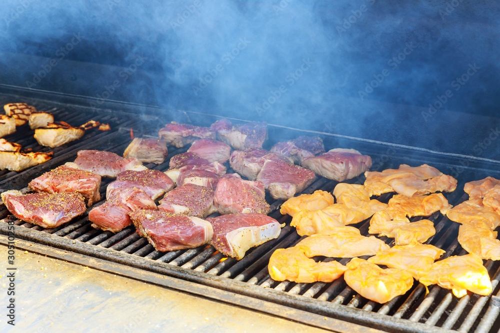 Steak on the grilled chicken salmon and beef with flames Steak on the grilled chicken salmon and beef with flames
