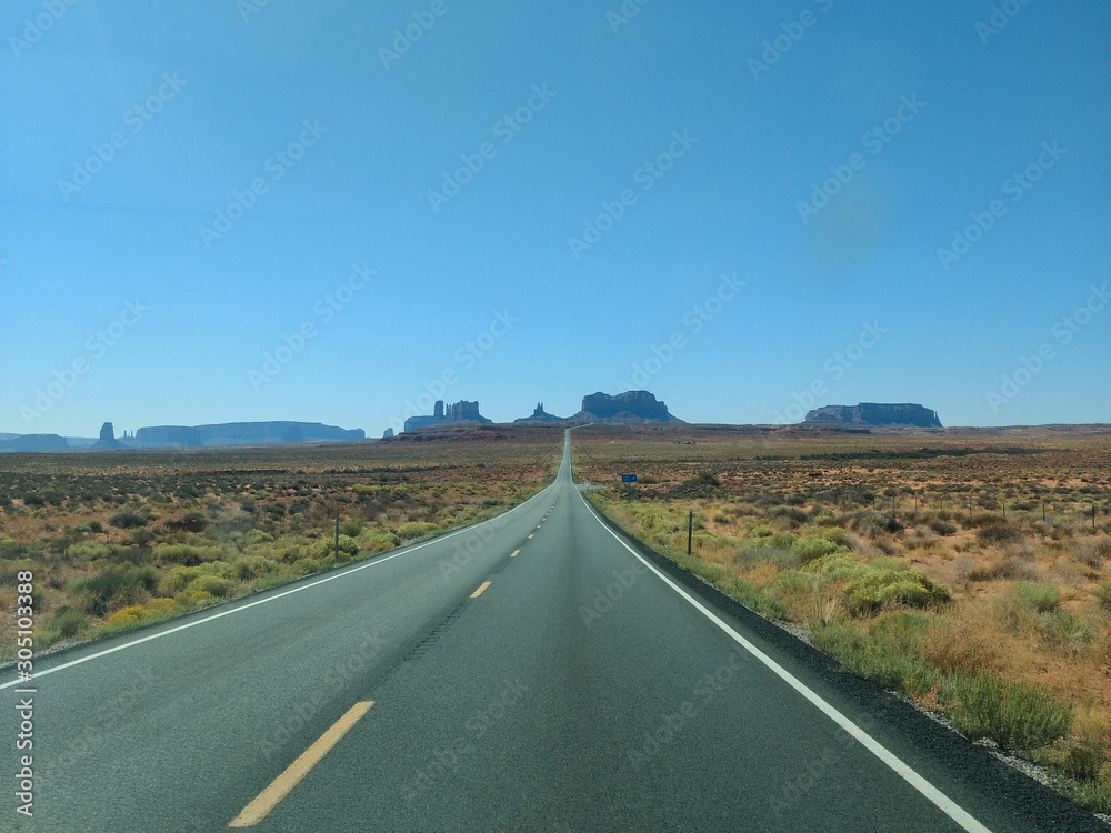 A lonely road crossing through the desert towards to Navajo Land