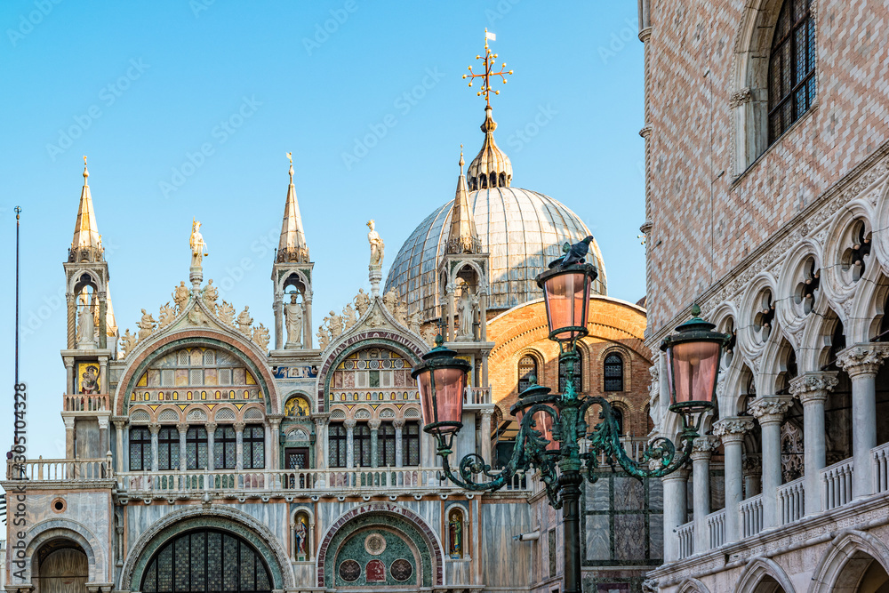 Famous venezian street lamps with pink glass in front of Basilica di San Marco in Venice, Italy