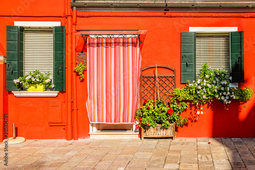 Orange house on Burano island near Venice, Italy
