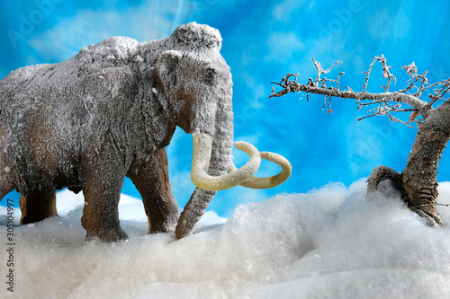 Prehistoric woolly mammoth model diorama scene