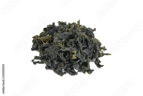 heap of Dried kombu seaweed isolated on white background. 45 degrees view.spices and food ingredients