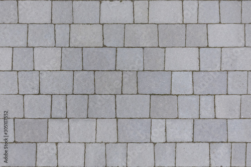 Grey stone pavement seamless texture. Abstract background of pavement close-up. Seamless texture. Perfect tiled on all sides