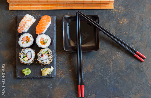 Oriental Japanese food based on sushi, maki, nigiri, unagi, wasabi, rice and fresh fish photo