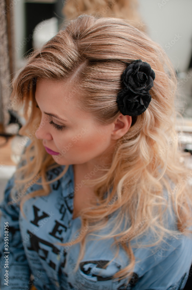 Portrait of a blonde girl with curly hairstyle Portrait of a blonde girl with curly hairstyle