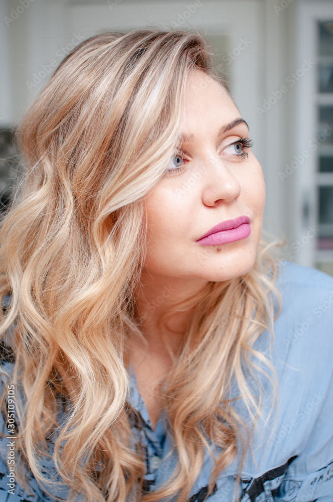 portrait of a young blonde woman with blue eyes portrait of a young blonde woman with blue eyes
