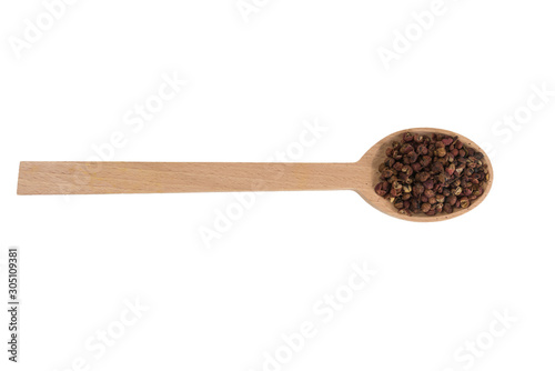 sichuan pepper in wooden spoon isolated on white background. spices and food ingredients. spices and food ingredients