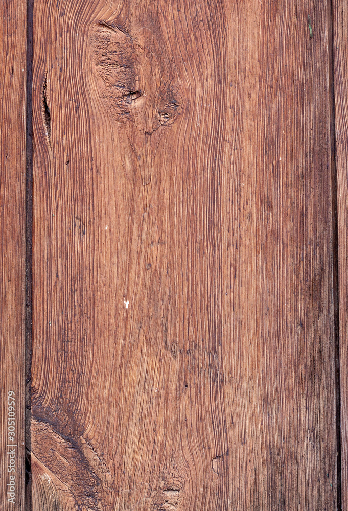 .Wood background texture wth a knot. Dark brown. .Wood background texture wth a knot. Dark brown.
