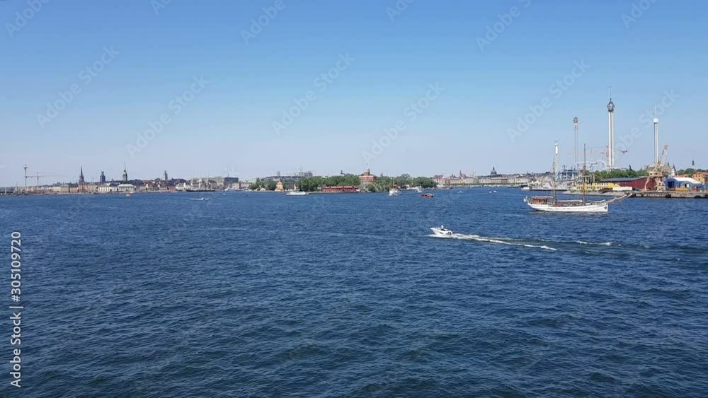 View of the blue ocean and coastline. Ships and yachts sail on the blue ocean. View of the city and the ocean from the board of the ship. View of the blue ocean and coastline. Ships and yachts sail on the blue ocean. View of the city and the ocean from the board of the ship.