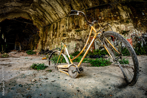 old abandoned bicycle in an abandoned industrial complex