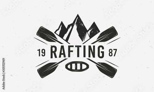 Mountains rafting logo with raft, crossed paddles and mountains silhouettes. Vintage typography. Vector illustration