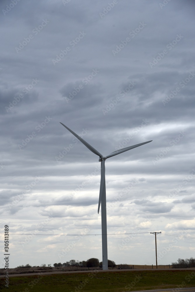 Wind turbine with a storm on the horizon
