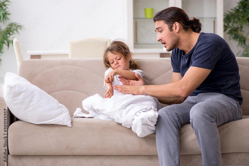 Father taking care of his ill daughter Father taking care of his ill daughter