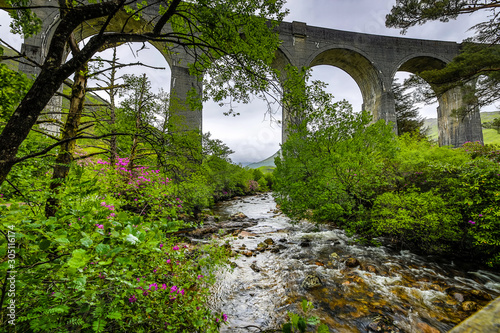 Old bridge and picturesque Scotland morning landscape.