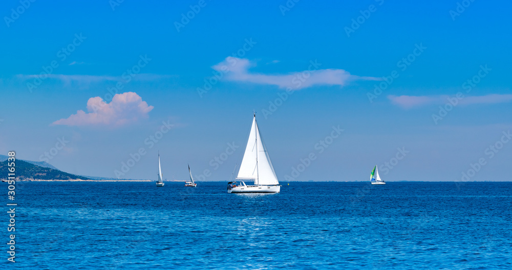 Racing sail boats at mediterranean sea. Lucury holidays concept