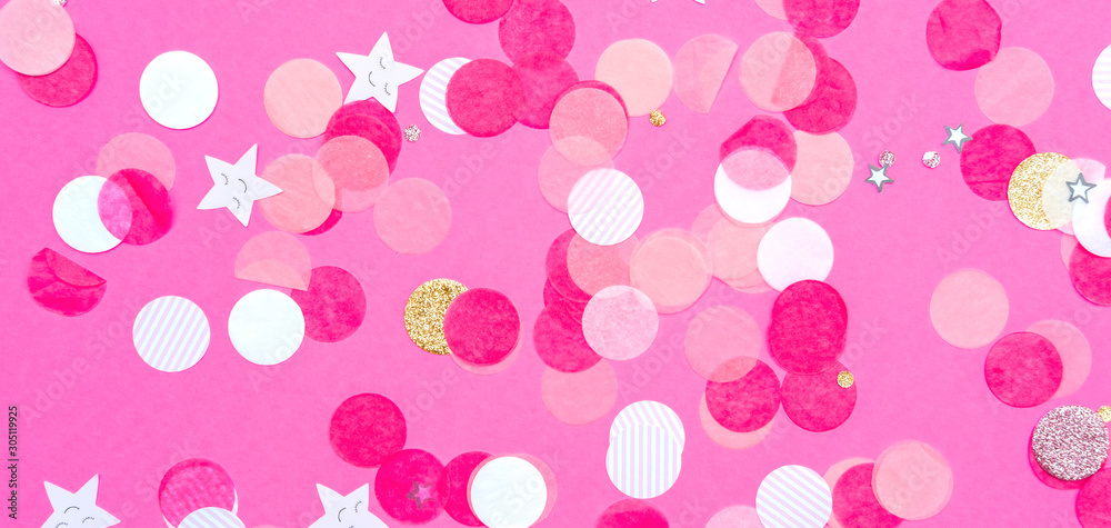 Multicolor pink, gold and white confetti on the bold pink background, holiday celebration backdrop, Flat lay style, banner format