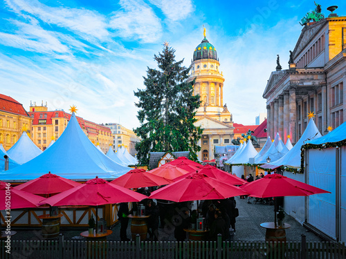 Night Christmas Market of Gendarmenmarkt in Winter Berlin  Germany. German street Xmas and holiday fair. Advent Decoration and Stalls with Crafts Items on the Bazaar.