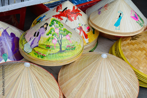 Decorated conical Asian hats exposed for sale. Hoi An, Vietnam