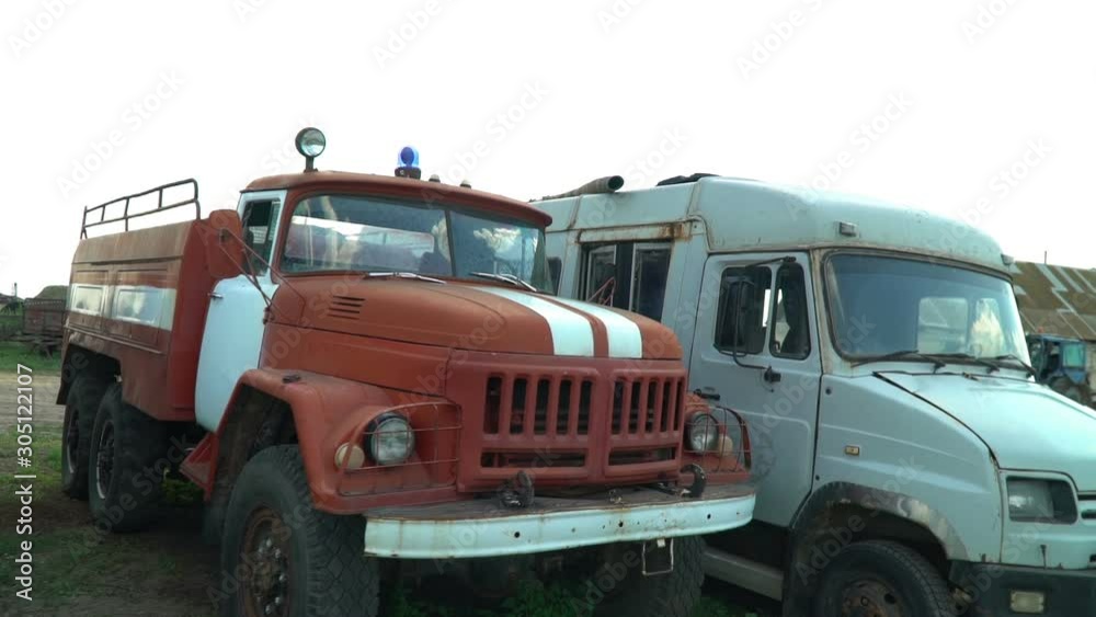 Old soviet trucks stand broken on the collective farm Old soviet trucks stand broken on the collective farm