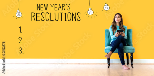 Tableau sur toile New years resolution with young woman holding a tablet computer