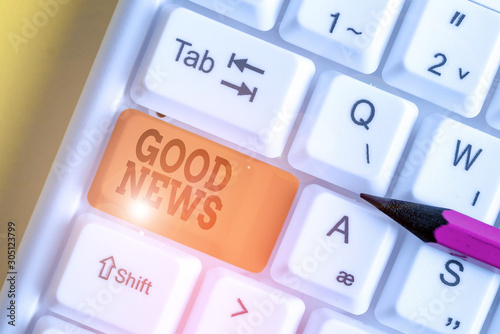 Word writing text Good News. Business photo showcasing Someone or something positive Encouraging uplifting or desirable White pc keyboard with empty note paper above white background key copy space photo