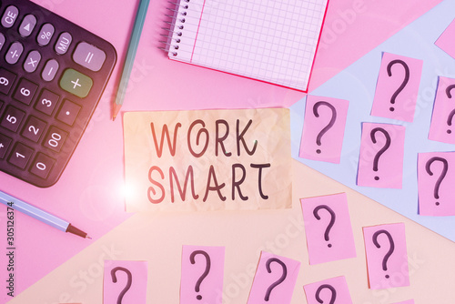 Writing note showing Work Smart. Business concept for figuring out in order to reach goals in the most efficient way Mathematics stuff and writing equipment above pastel colours background