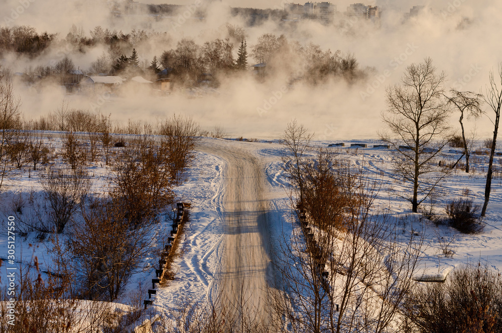 winter landscape of frozen road and river. rising sun. winter landscape of frozen road and river. rising sun.