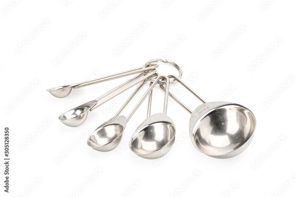 Stainless steel measuring spoons isolated on white background with