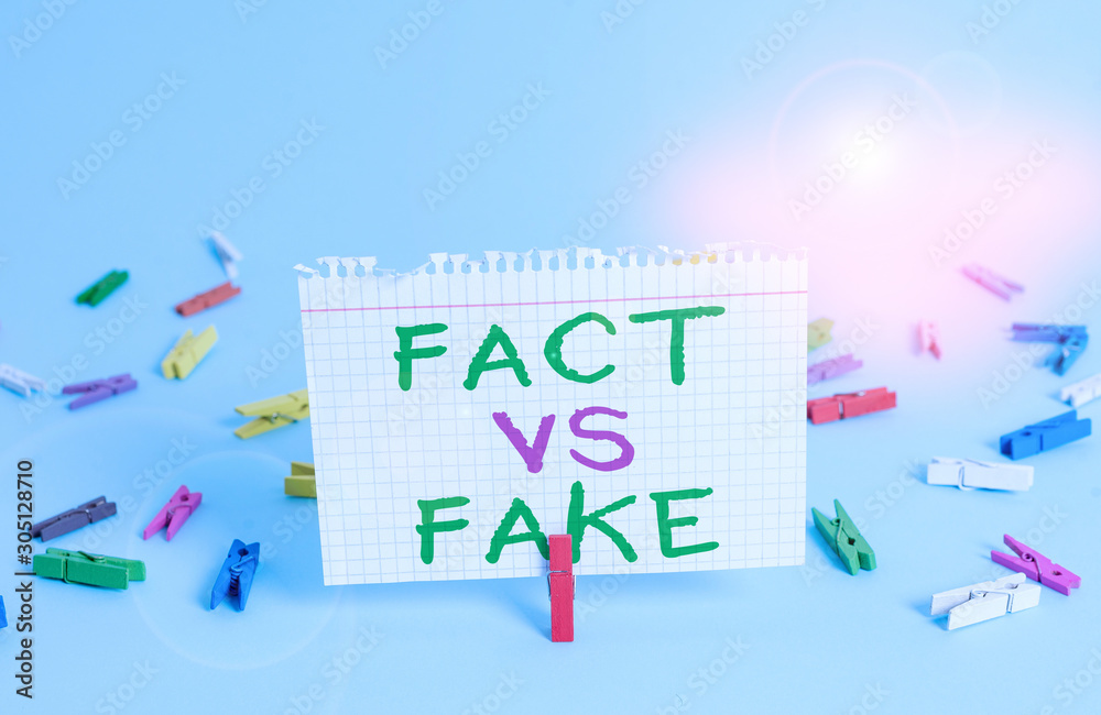 Word writing text Fact Vs Fake. Business photo showcasing Rivalry or products or information originaly made or imitation Colored clothespin rectangle square shaped paper light blue background Word writing text Fact Vs Fake. Business photo showcasing Rivalry or products or information originaly made or imitation Colored clothespin rectangle square shaped paper light blue background