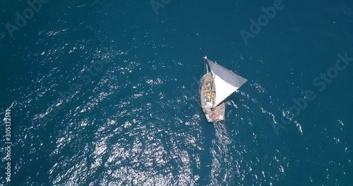 Traditional dhow sailboat sailing on the Indian ocean on the Swahili coast filmed with a drone, Tanzania.