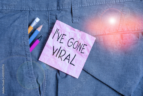 Text sign showing I Ve Gone Viral. Business photo text medical term used to describe small infectious agent Writing equipment and pink note paper inside pocket of man work trousers