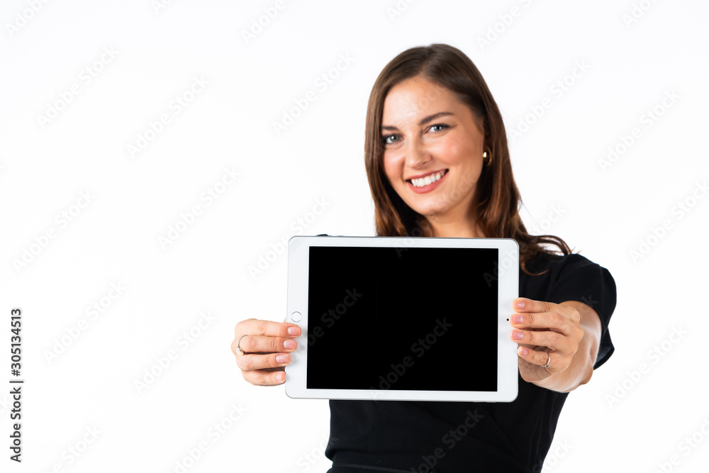 Young women in black dress hand holding tablet with white background Young women in black dress hand holding tablet with white background