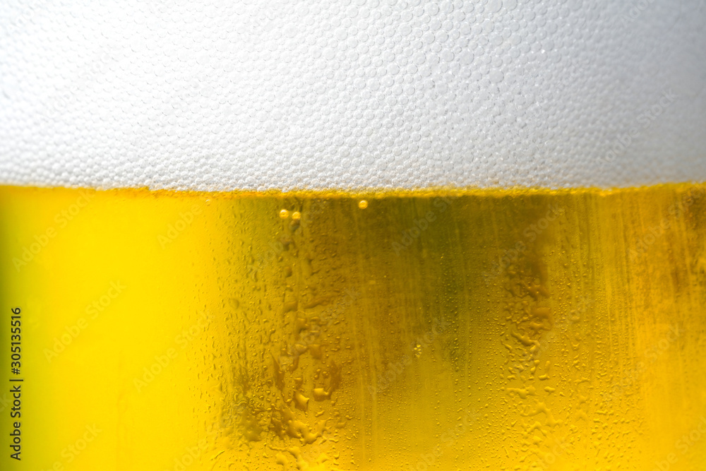 Background Cool beers with beer bubbles on top a glass at the party Background Cool beers with beer bubbles on top a glass at the party