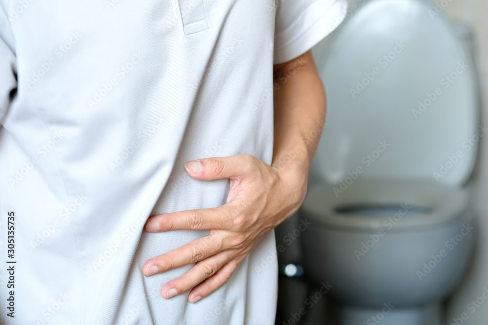 man have abdominal pain. Take a hand from the belly diarrhea.Health concept man have abdominal pain. Take a hand from the belly diarrhea.Health concept