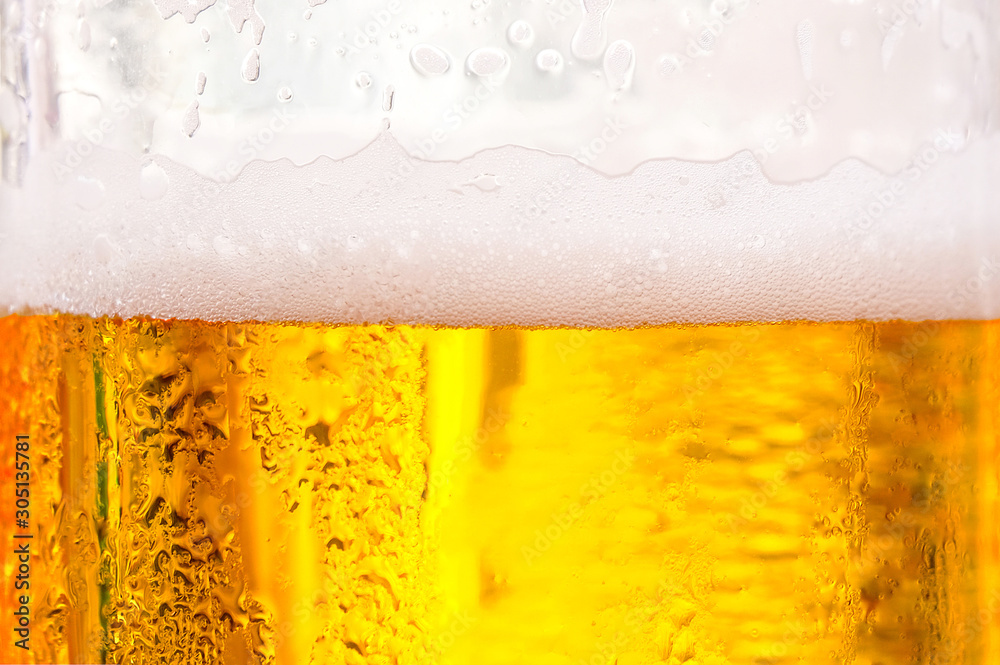 Background Cool beers with beer bubbles on top a glass at the party Background Cool beers with beer bubbles on top a glass at the party