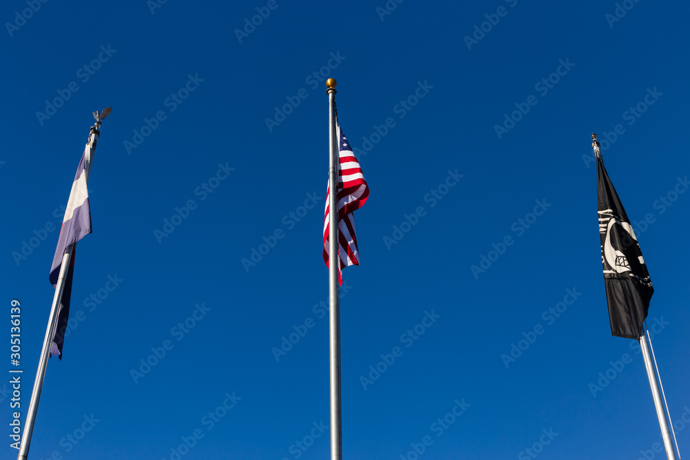 US, State of Colorado and POW/MIA flags at the Veterans Memorial in Elizabeth, Colorado.