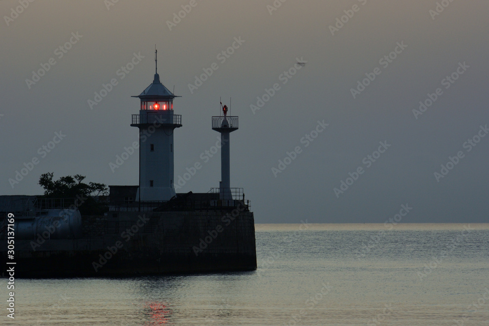 View of the lighthouse of the sea port of Yalta