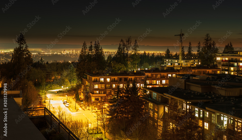 Looking South West towards dontown Vancouver in distance, from UniverCity on Burnaby Mountain, at nightfall