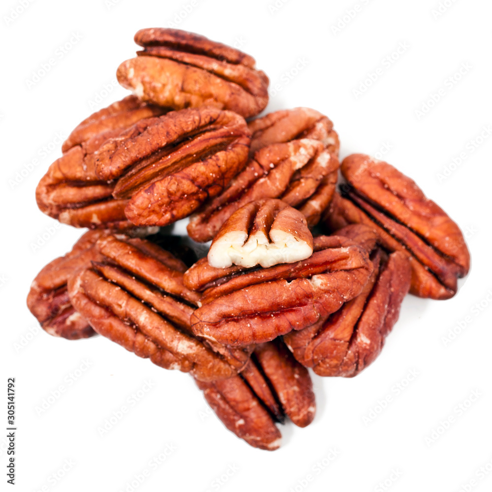 Peeled pecan nuts isolated on a white background. Top view. Peeled pecan nuts isolated on a white background. Top view.