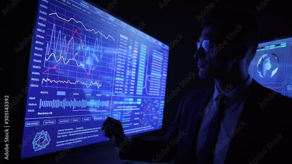 The man working on a blue sensor monitor
